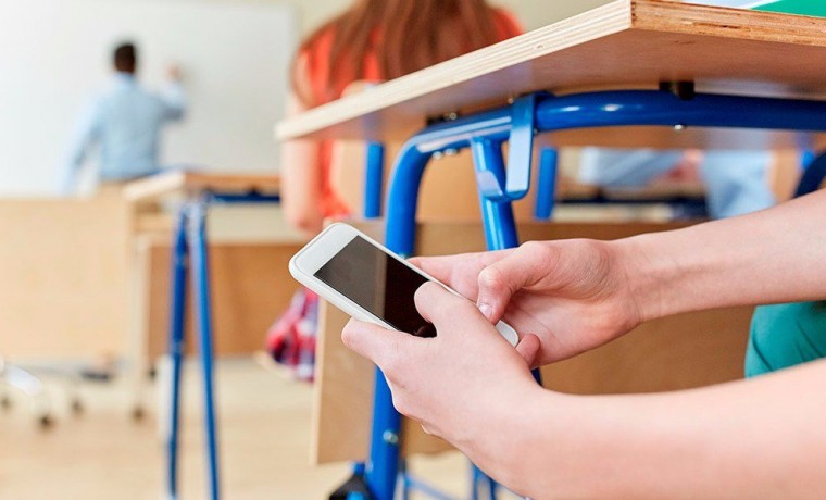 Mobile phone ban imposed in UK schools Mobile phone ban imposed in UK schools