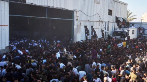 At least 10 die as hundreds of starving Palestinians attack UN food warehouse in Gaza