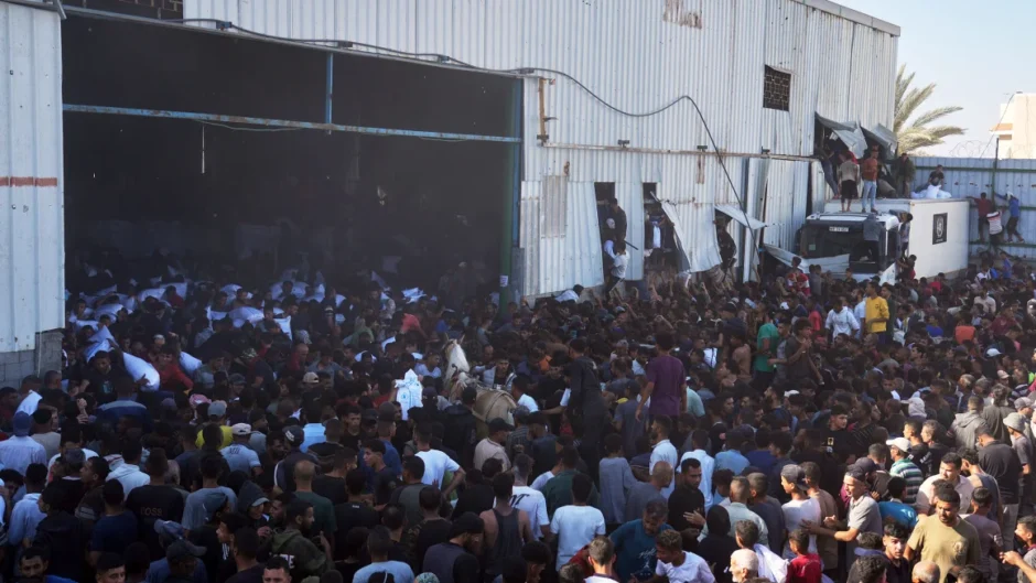 At least 10 die as hundreds of starving Palestinians attack UN food warehouse in Gaza At least 10 die as hundreds of starving Palestinians attack UN food warehouse in Gaza
